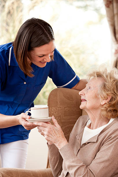 istock Elderly Lady and Carer 174869080