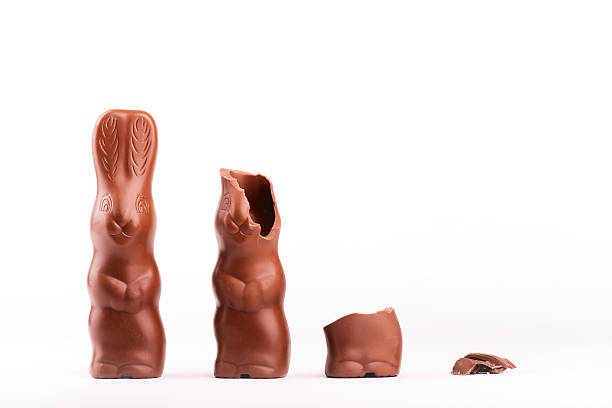 Chocolate bunnies on white Chocolate bunnies becoming smaller and smaller chocolate bunny stock pictures, royalty-free photos & images