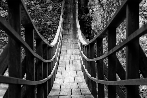 Modern wooden bridge over a mountain river in Slovenia, Europe