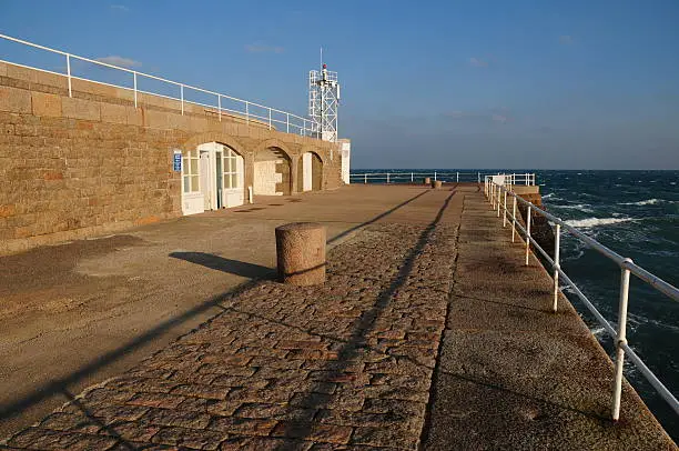Wide angle image of the end of a mile long breakwater.