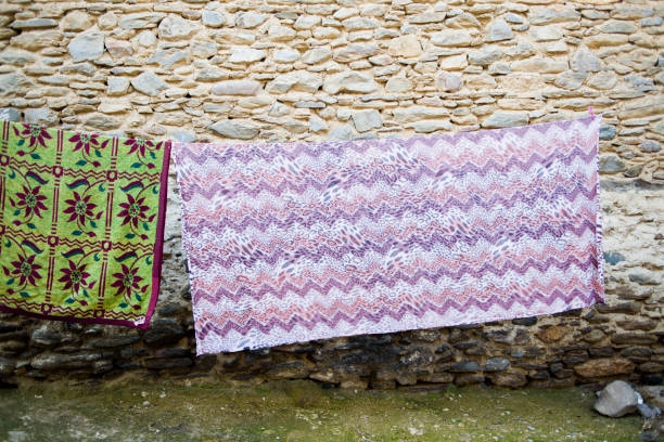 istock Bedsheets on the street for dry. Birgi, İzmir Turkey 174869702