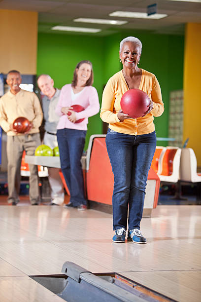 istock Seniors at bowling alley 174869762