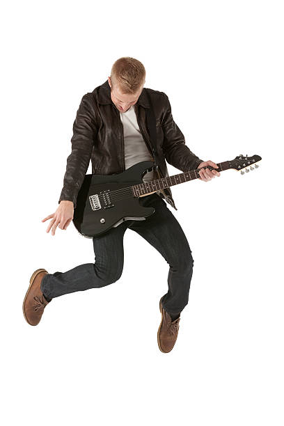 istock Excited young man playing a guitar 174869772