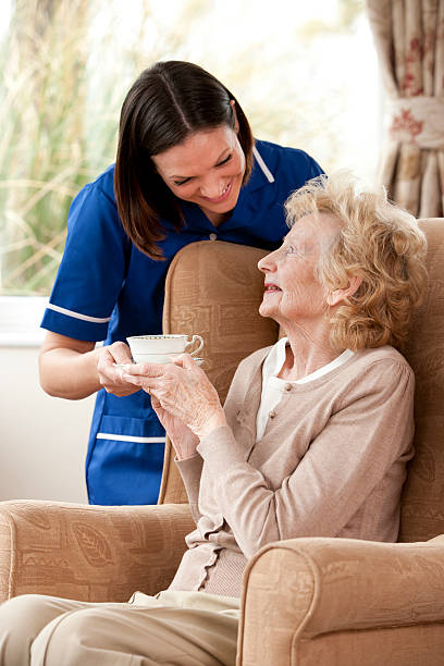 istock Senior Lady with Carer 174869879
