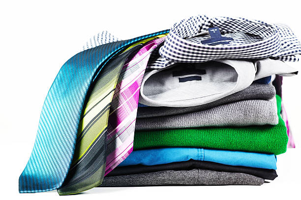 istock Stack of men clothing and ties on white background 174869990