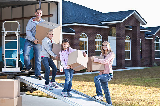 istock Family moving house, unloading truck 174870027