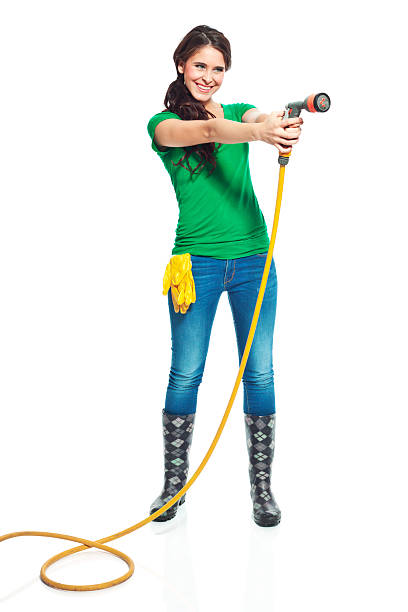 istock Gardener with garden hose 174870443