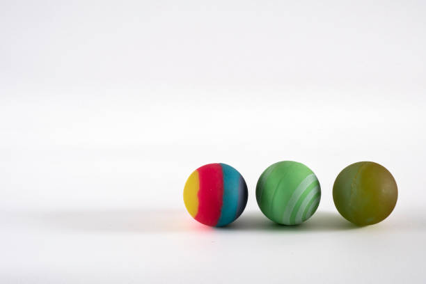 istock Rubber ball of various colors on a keyboard. 1748705677