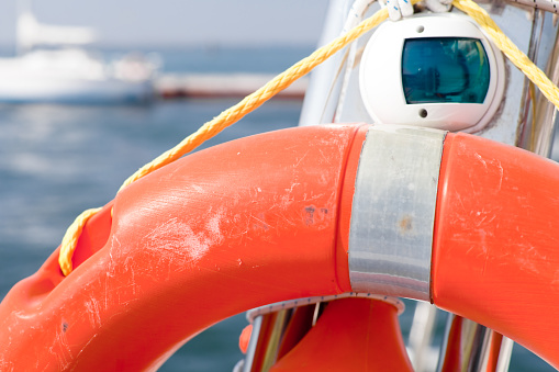 Rescue sea  ring orange on the boat