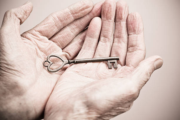 istock Hand holding key to success 174870940