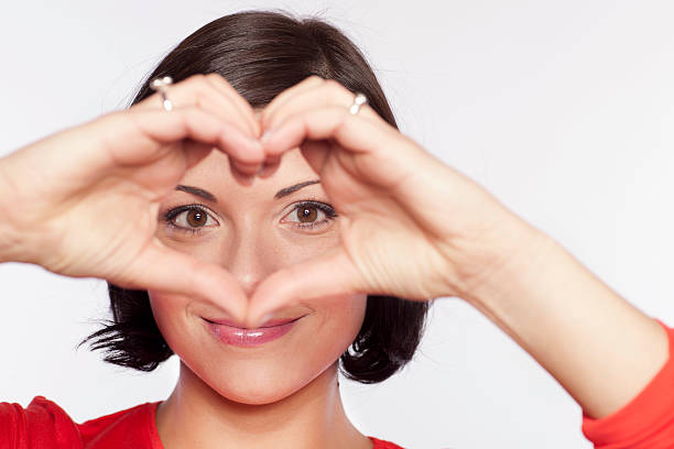 istock Woman is forming heart shape with fingers 174870974