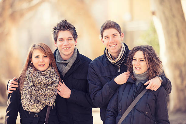 istock Friends outdoors embracing  and smiling 174871451