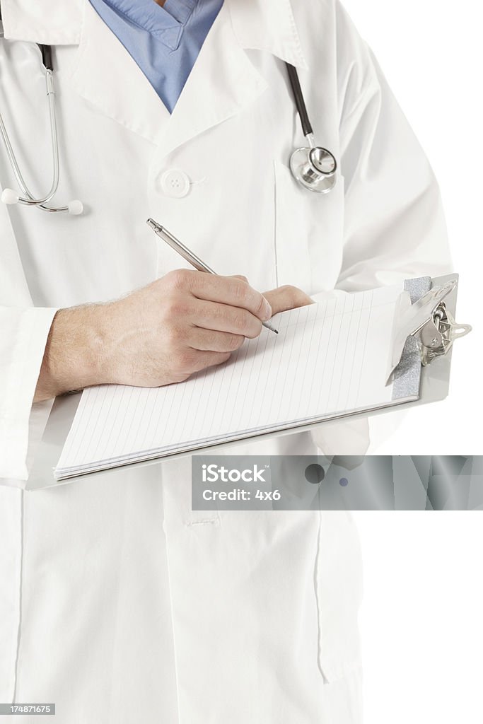 Masculino médico escrevendo notas - Foto de stock de 20 Anos royalty-free