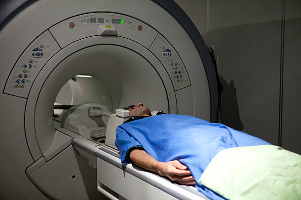 istock Man having a medical examination via MRI scanner 174872022
