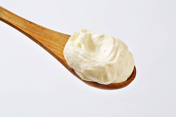 Cream spread on a wooden spoon