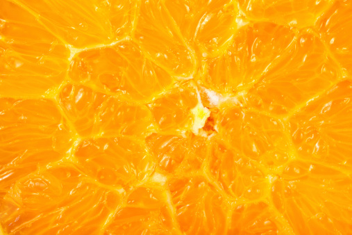 Macro shot of juicy orange cross section.