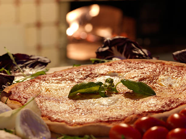 istock Pizza baked in wood oven 174872822