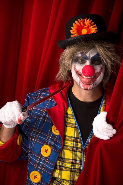 istock Creepy Clown behind the curtain 174872979