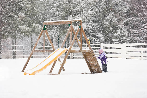 istock Girl Playing in Snow 174873168