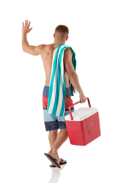 задний вид человек, для пикника - male swimwear cooler 20s стоковые фото и изображения