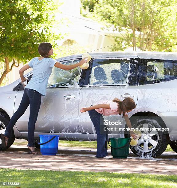 Two Girls Washing Car Together Stock Photo - Download Image Now - Car Wash, Car, Washing