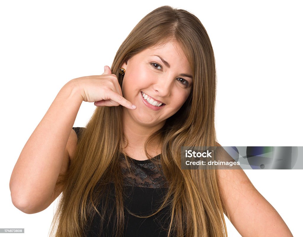 Young Woman Gestures Call Me Telephone Hand Sign Portrait of a young woman on a white background. 18-19 Years Stock Photo