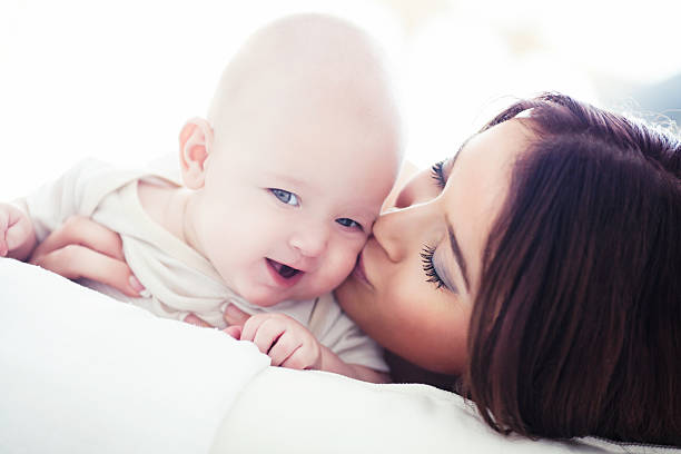 istock Mother's Kiss 174873989