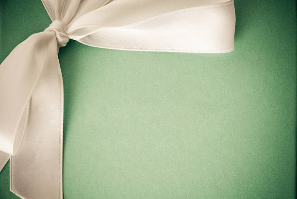 istock Green cardboard and white ribbon 174874057