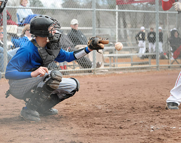 istock Baseball catcher about to catch ball 174874339