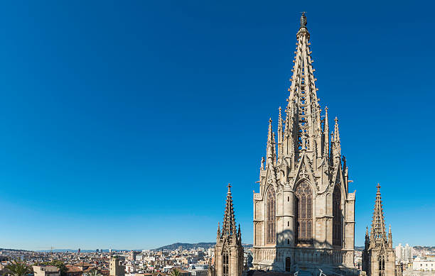 Gothic spire soaring into blue skies Barcelona Cathedral Spain