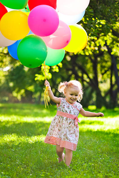 istock Cute girl with balloons 174874775