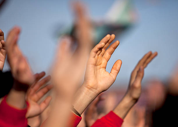 istock Group of people with arms raised above 174874788