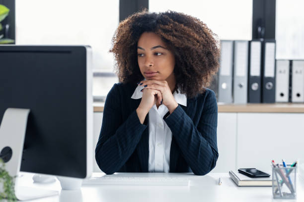 istock Elegant business woman working with computer in a modern office 1748748607