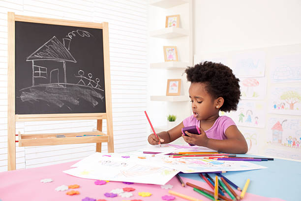 istock Little girl painting. 174874938