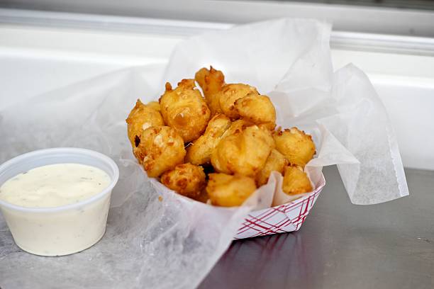 Cheese curds from the Wisconsin State Fair Cheese curds with some tasty ranch on the side. curd cheese photos stock pictures, royalty-free photos & images