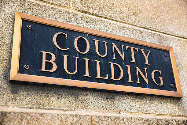istock County building brass sign 174875097