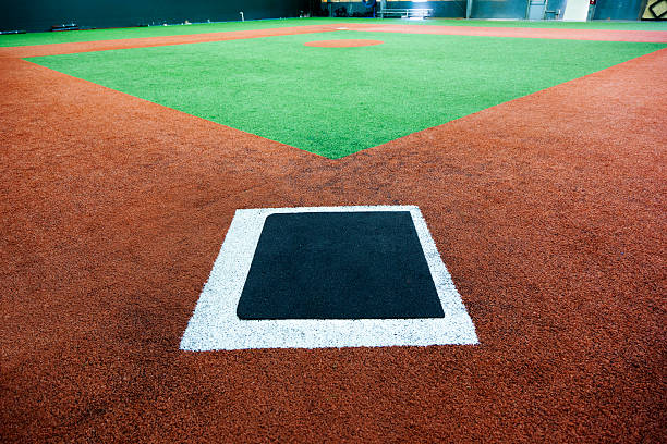 istock Indoor baseball diamond with a view from the home plate 174875140