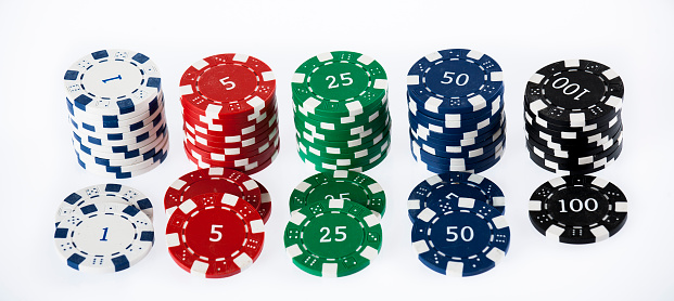 Gambling chips stacks over white background