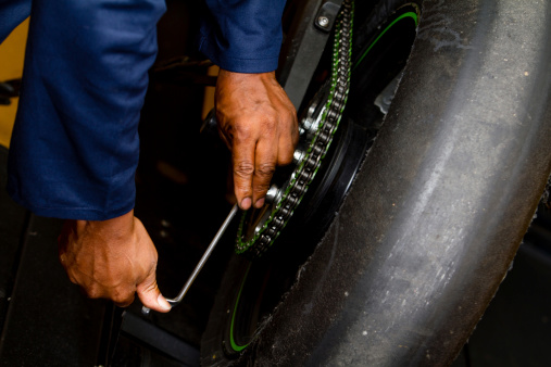 Close-up of a man's hands fixting a tire