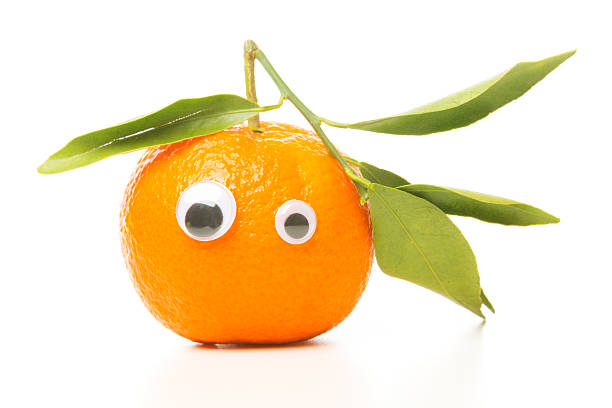 istock funny tangerine with eyes 174875375
