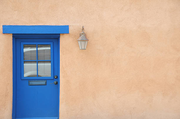 istock Brown Wall and Blue Door in New Mexico 174875389