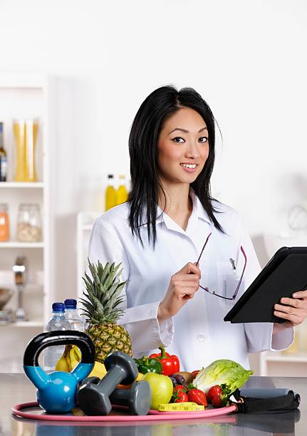 istock Oriental Healthcare Professional Using Digital Tablet 174875487