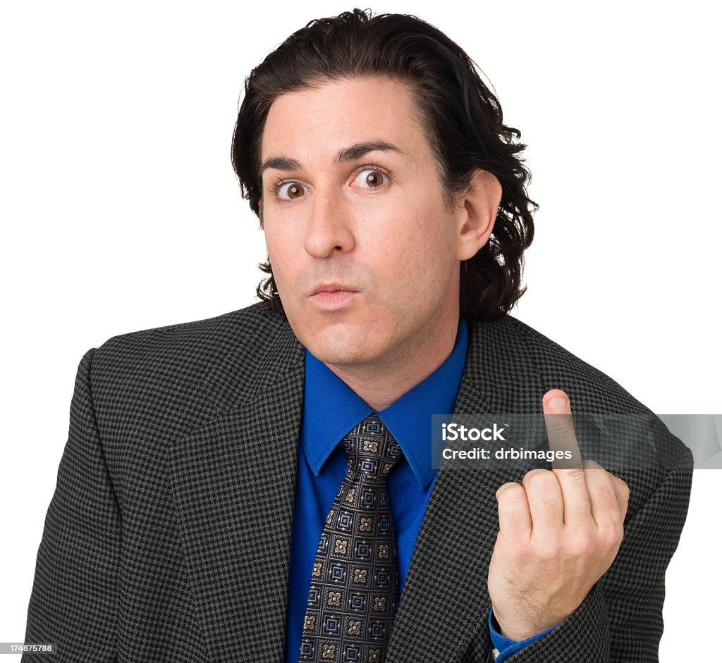 Man In Suit Gives Middle Finger To Camera Portrait of a mid adult man isolated on a a white background. Businessman Stock Photo