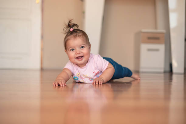 istock Seven-month-old baby trying to crawl. 1748764003