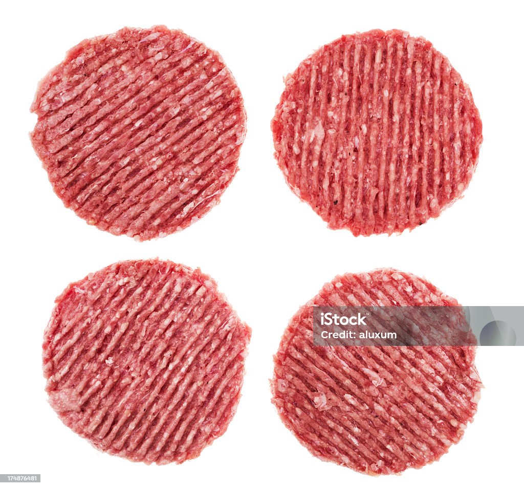 Bœuf hamburgers et quatre - Photo de Aliment libre de droits
