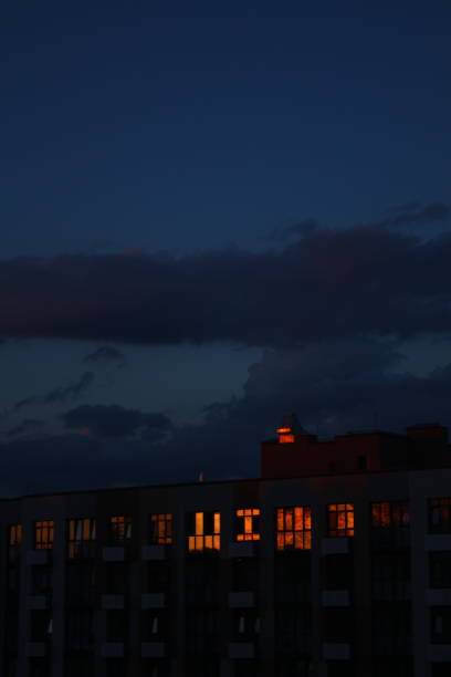 istock the bright sunset is reflected in the windows of the house 1748766206
