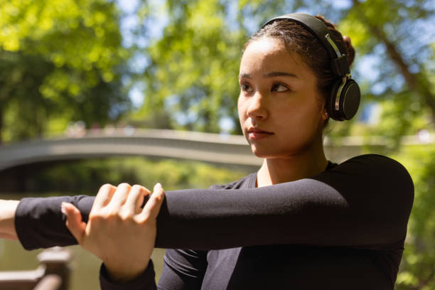 istock Multiracial girl jogging in Central Park 1748766730
