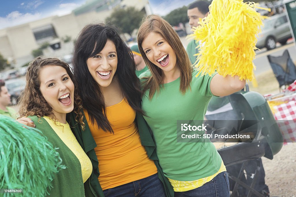 Excited group of college sports fans cheering at tailgate party Tailgate Party Stock Photo
