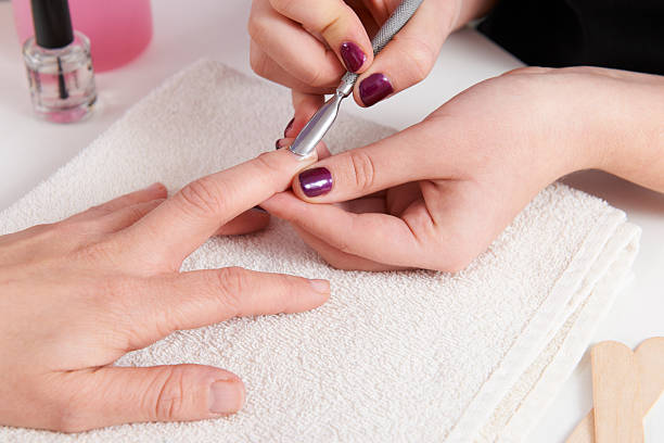 istock Woman Having Manicure At Beauty Salon 174876783