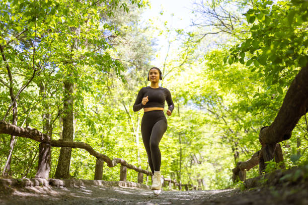 istock Multiracial girl jogging in Central Park 1748769071